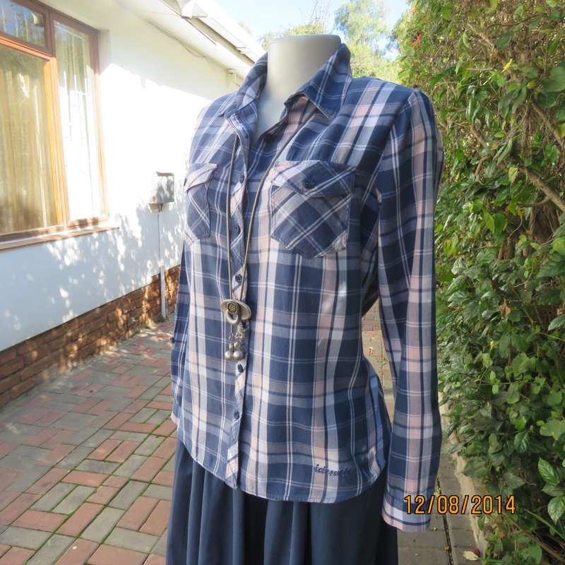 Casual long sleeve check button down top in blues.Peach touches. Two pockets.By IDENTITY.Size 36.