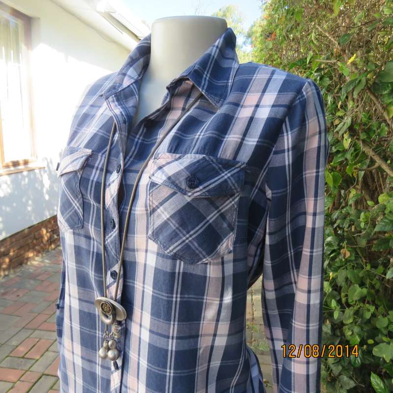 Casual long sleeve check button down top in blues.Peach touches. Two pockets.By IDENTITY.Size 36.