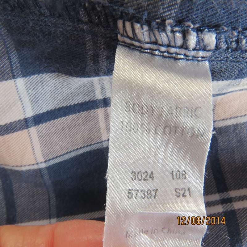 Casual long sleeve check button down top in blues.Peach touches. Two pockets.By IDENTITY.Size 36.