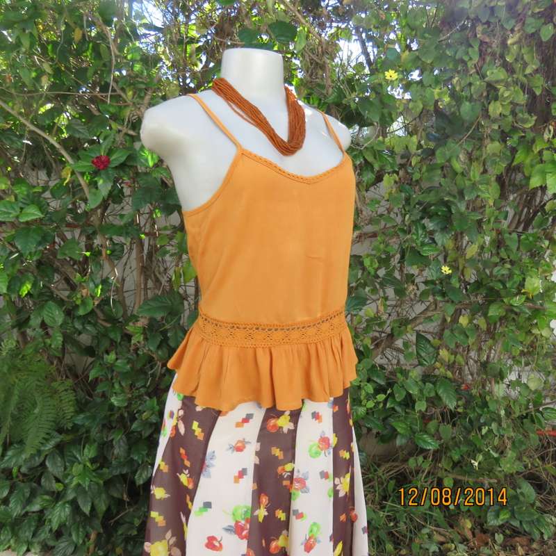 Cute pumpkin colour strappy top with peplum frill/lace decoration. Size 34 by RE. Very good cond.