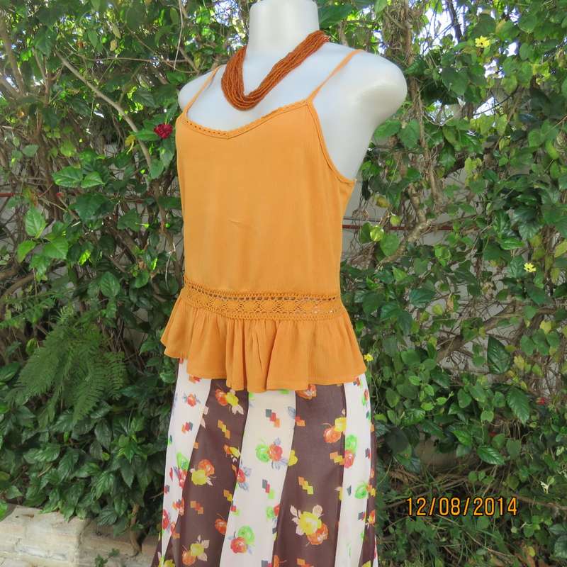 Cute pumpkin colour strappy top with peplum frill/lace decoration. Size 34 by RE. Very good cond.