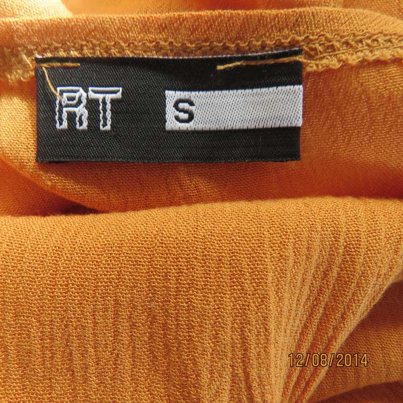Cute pumpkin colour strappy top with peplum frill/lace decoration. Size 34 by RE. Very good cond.