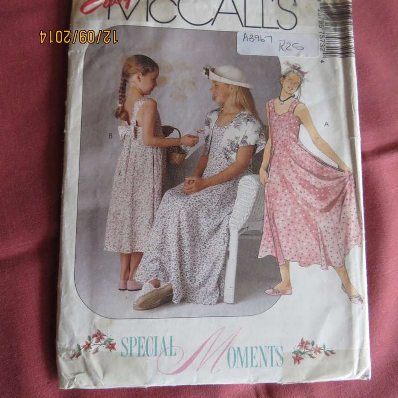 Sewing pattern for girls special dress with bolero and bow. McCALLS 7573. Age 2 to 14. Complete.