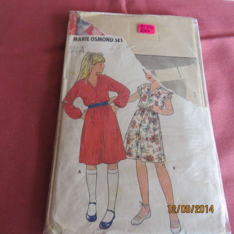 Sewing pattern by BUTTERICK 6658 for 7 to 12 yr old girl. Easy to make 4 pieces dress. Very good con