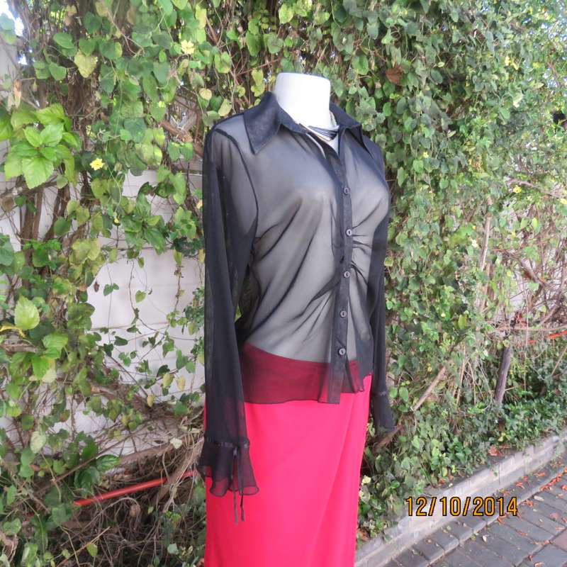 Chic black sheer polyester button down top/open collar. Pretty flare cuffs on sleeves.Size 36.As new