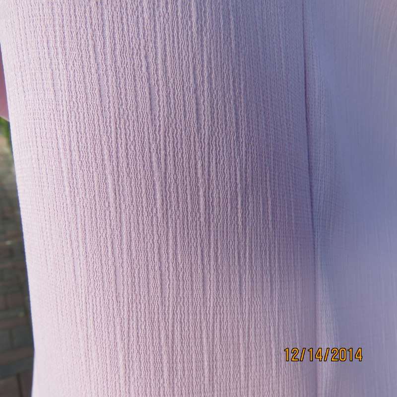 Boutique made lavender short sleeve top/jacket.In vertical textured polyester, Size 37/13. As new