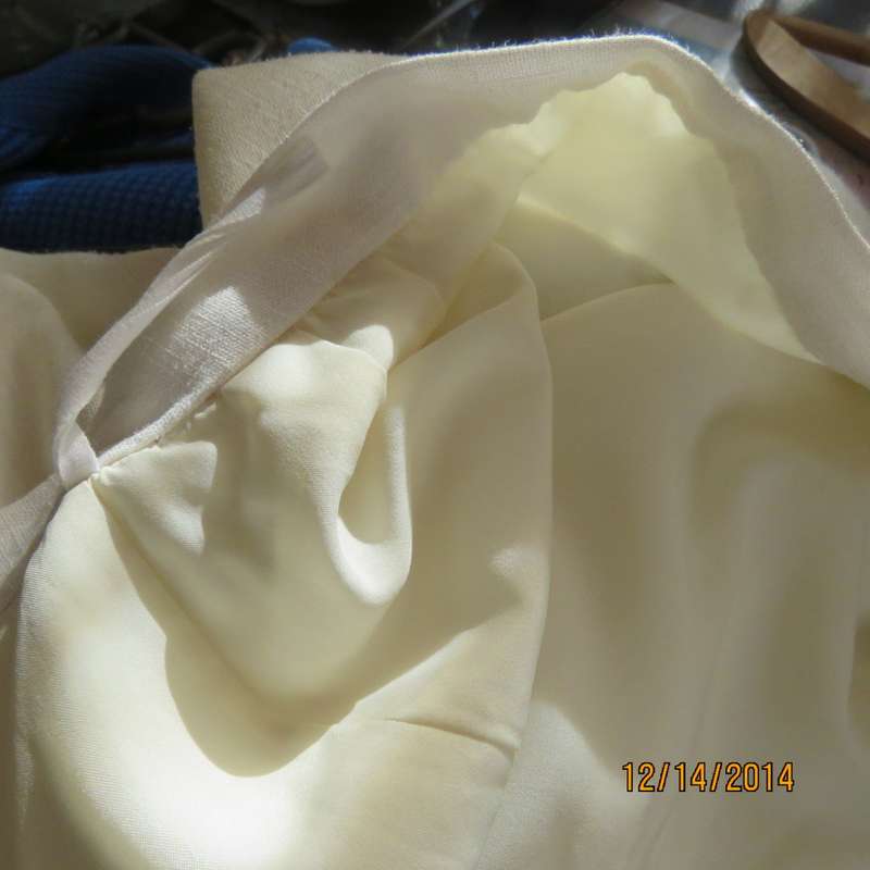 One of a kind boutique made lined pencil skirt in ivory textured polycotton. Size 34 New cond.
