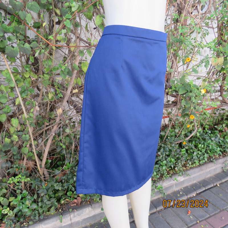 Handy cobalt blue polycotton pencil skirt with zip and pleat at back. Size 40. Very good cond.