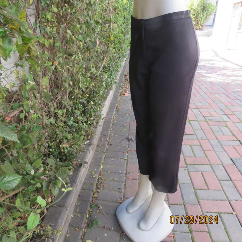 Black silky,shiny stretch polyester ankle length pants by MERIEN HALL size 35. Very good condition