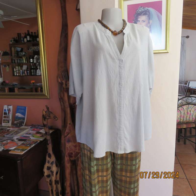 Creased cotton slip over soft mint green top. Short cut-on sleeves. Gathering at back.Size 40.V neck
