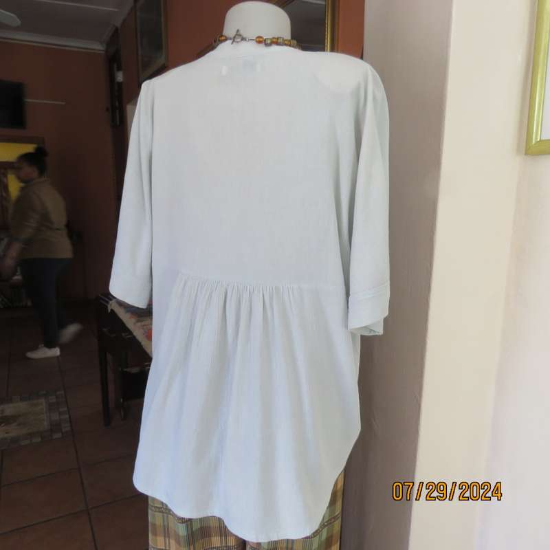 Creased cotton slip over soft mint green top. Short cut-on sleeves. Gathering at back.Size 40.V neck