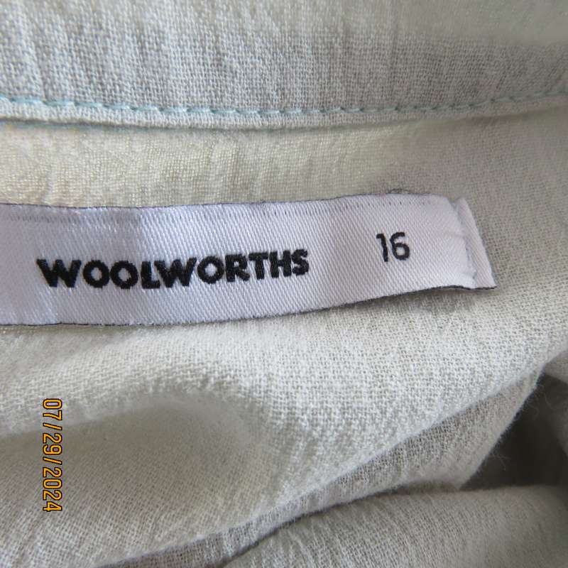 Creased cotton slip over soft mint green top. Short cut-on sleeves. Gathering at back.Size 40.V neck