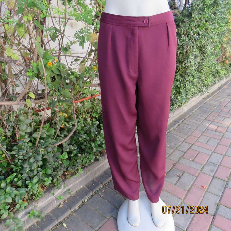 As new ladies trousers in plum polyester by TRUWORTHS size 36/12. Tapered legs. Elastic waist back.