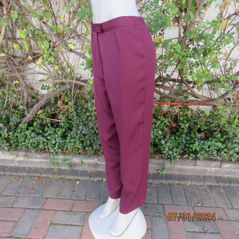 As new ladies trousers in plum polyester by TRUWORTHS size 36/12. Tapered legs. Elastic waist back.