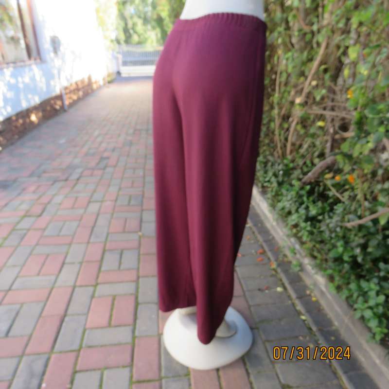 As new ladies trousers in plum polyester by TRUWORTHS size 36/12. Tapered legs. Elastic waist back.