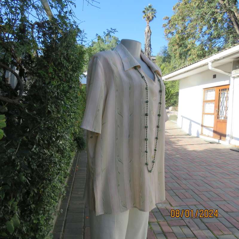 Elegant button down open V and collar top. Peach/green/cream pattern stripes. Size 42. New condition
