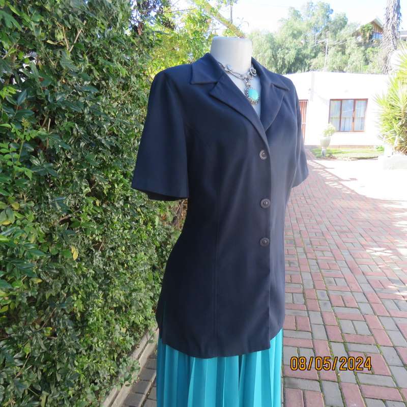 Classic navy button down princess cut short sleeve jacket. Notched collar.Size 38 by TOPICS.