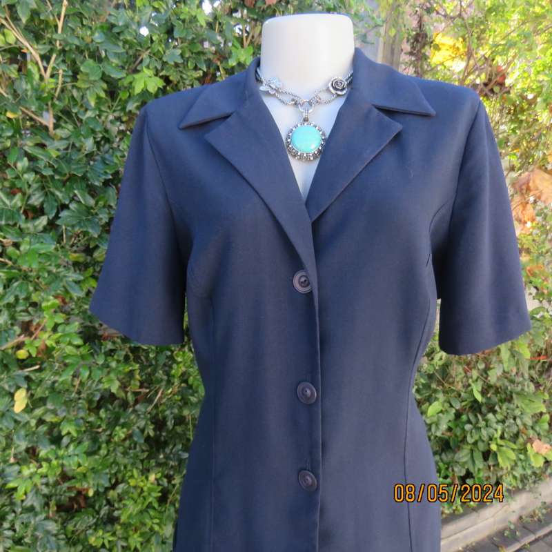 Classic navy button down princess cut short sleeve jacket. Notched collar.Size 38 by TOPICS.