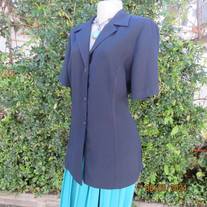 Classic navy button down princess cut short sleeve jacket. Notched collar.Size 38 by TOPICS.