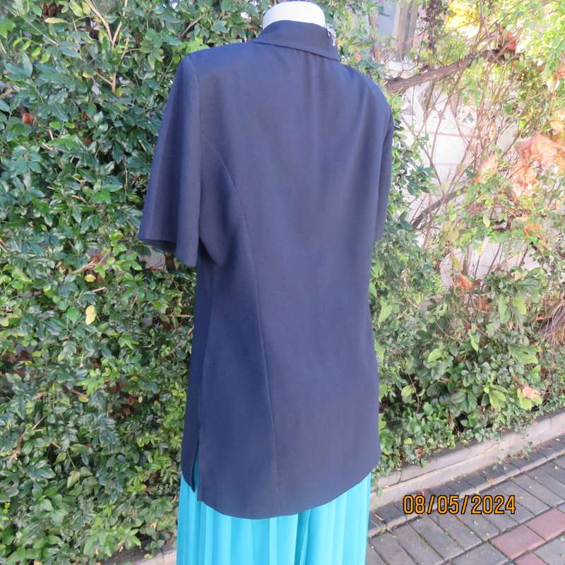 Classic navy button down princess cut short sleeve jacket. Notched collar.Size 38 by TOPICS.