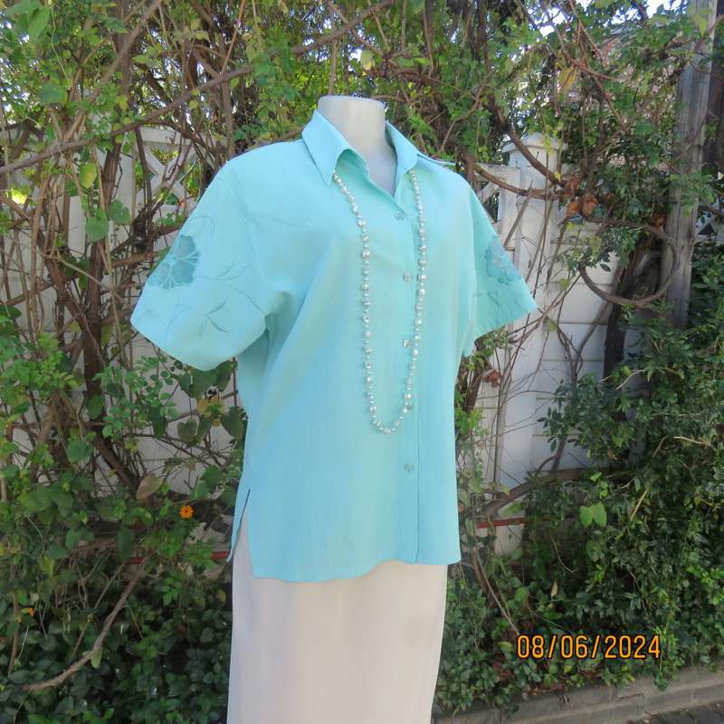 Mint green corded cotton short sleeve button down top by JADORE size 36. Opaque emb. sleeve flowers
