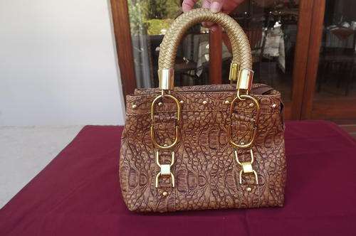 Vintage crocodile skin textured handbag.