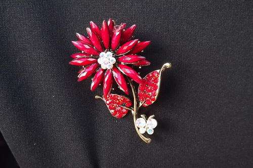 Fashion flower brooch with red stones - still in box