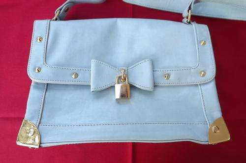 Light Grey Blue Shiny Handbag by Queenspark - bow decoration on front with lock - corners protected
