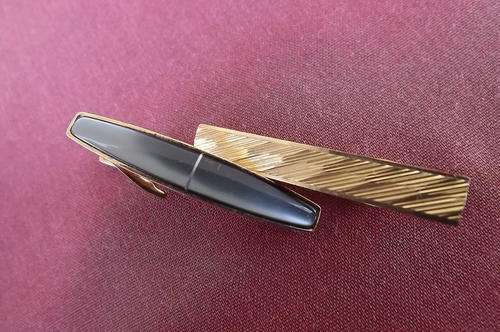 Lot of 2 Tie Clips - one with greyish stone - other plain gold colour - very good condition
