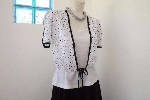 Soft polyester Bolero in Off White with small Black Squares & Black Edging in 32/8 good condition