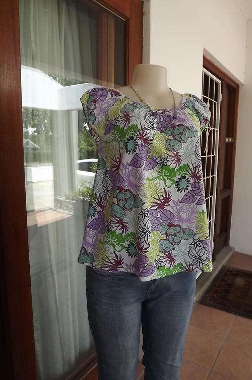 White with Purple and Green Floral Design Top in size 8/32 - used but good for everyday wear.