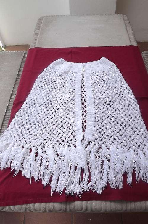 White Hand Knitted Poncho for 10-12 year old in lace stitch-width at neck opening 56cm-length 56cm
