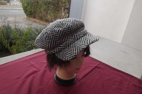 Black & White Tweed Cap by Woolworths - Elasticated back - one size in good condition