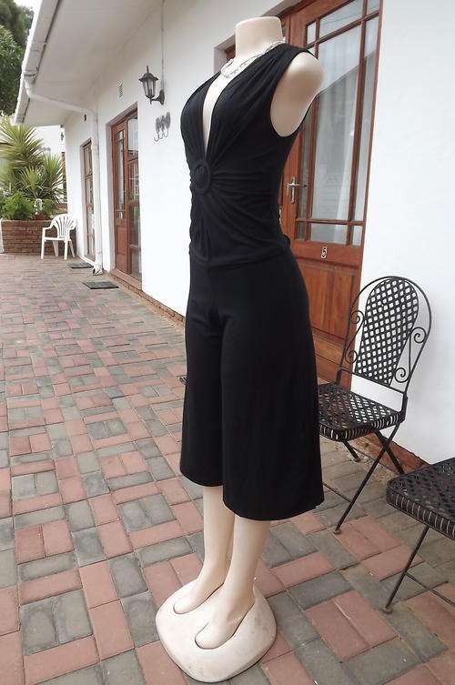 Black Jumpsuit in size 12/36 by Identity - knee length - gathered on front - used but in good cond