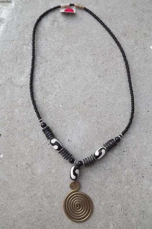Black and White Choker with Brass Pendant . Wide enough to fit all. Pendant can be replaced.