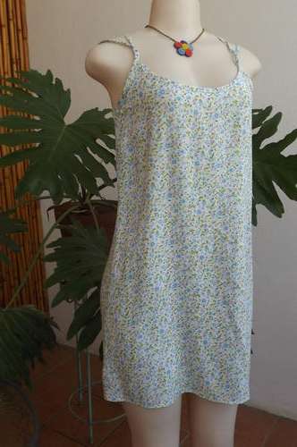 Mini dress by Foshini with thin cross over shoulder straps.Size 36/12.Used but in good condition