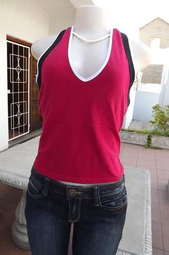 Red stretch outback red sport-top with build in bra.Size 36/12.Black and white edging.Good used cond
