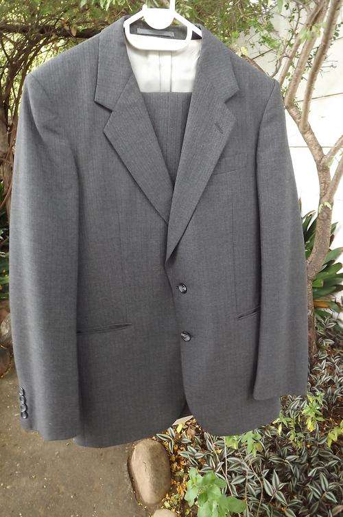 Dark grey Man About Town Trevira suit with 45% new wool.Trousers waist 81cm.Jacket chest 102cm.New