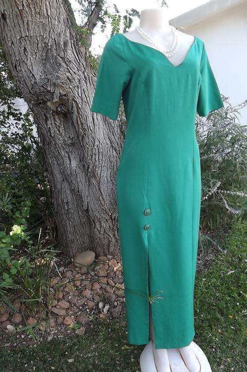 Emerald green long dress in princess style.High slit on right front.Size 35/11.Bust 92cm.Hips 100cm.
