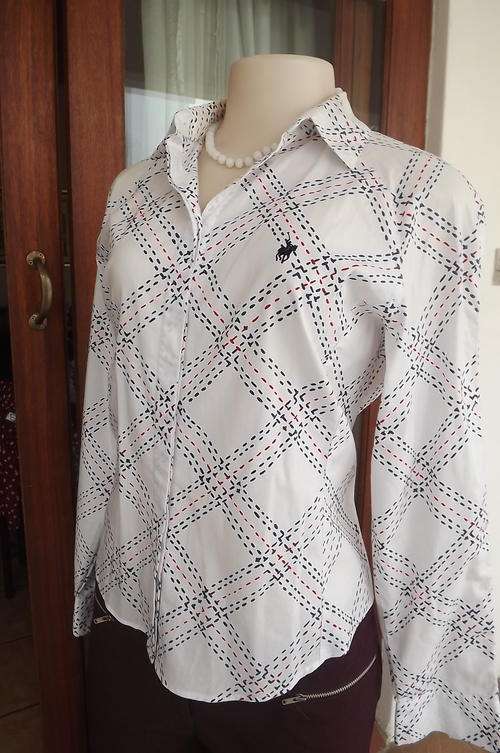 Beautiful ladies Polo Softwear shirt.Styled with navy&red broken line pattern.Size 34/10.