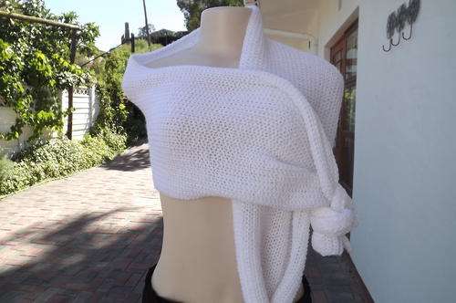 White knitted acrylic scarf.Length 190cm Width 29cm.Soft and in new condition