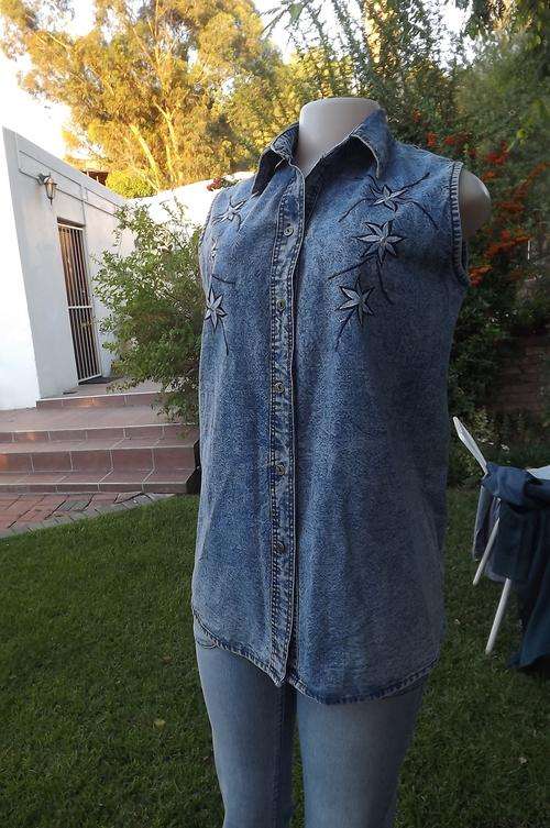 Beautiful sleeveless denim button down loose top with embroidery on front.Size Medium.Size 36/12.