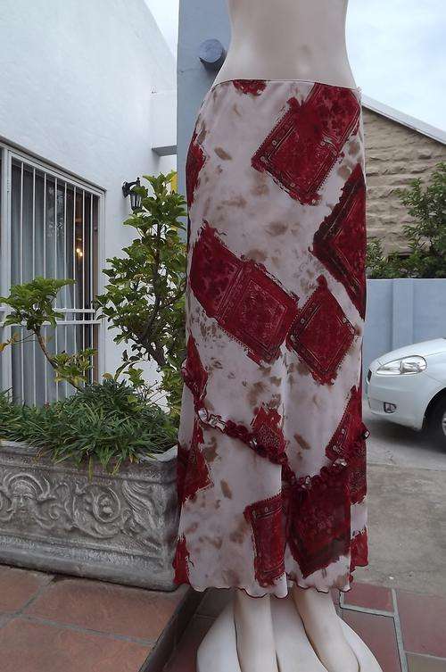 Beige and red block pattern lined sheer polyester maxi skirt.Size 38/14 by Exact.Elasticated middle.