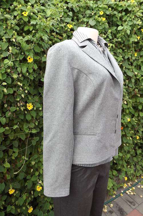 Smart silver grey tailored jacket from Truworths in size 36/12.Two dummy pockets on front.
