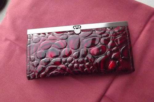 Brand new dark red purse with 4 divisions.lose with metal clip.Very pretty. 19.5 x 9.5
