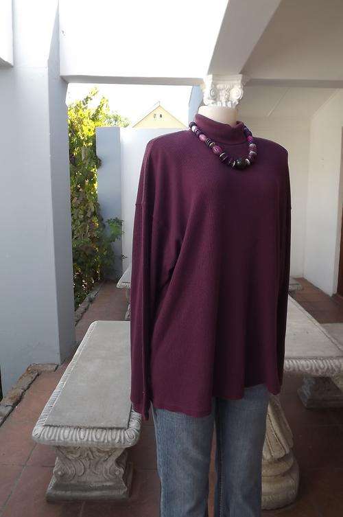Comfortable dark purle poloneck polycotton stretch sweater in size 46/22 by Celio. Good condition.