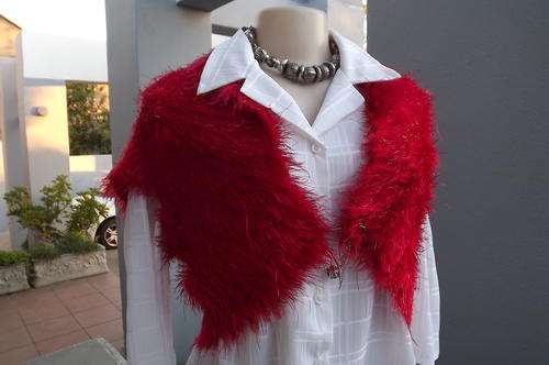 Stunning red fluffy knitted bolero with glitter thread.Size 34/10.Fasten on front. New condition.