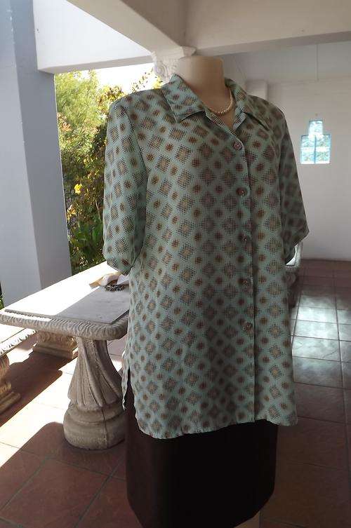 Pastel turquoise blouse with diamond shaped gold pattern.Size 40/16 by Judy's Pride.Slitted sides