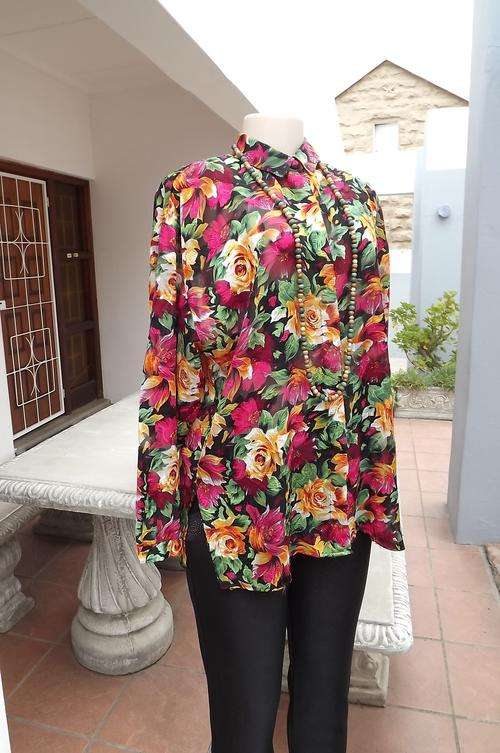 Pretty floral blouse by Shelley size 36/12.Sheer black with gold&pink embossed roses.Disquised bu