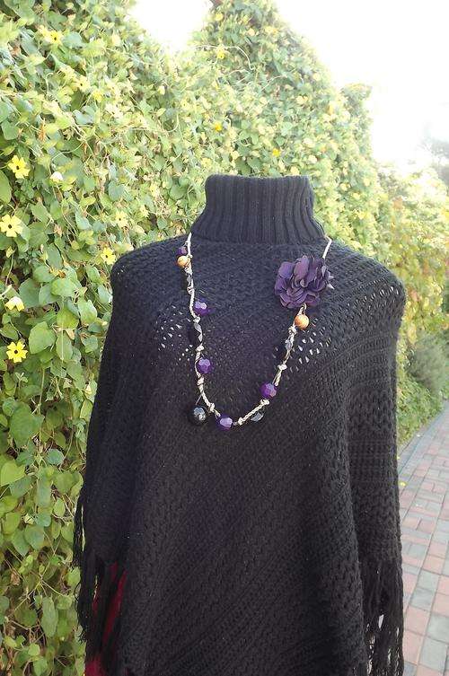 Poncho in black acrylic knit with poloneck by Gerardina size small 32/8.Fringed edging.Used but in g